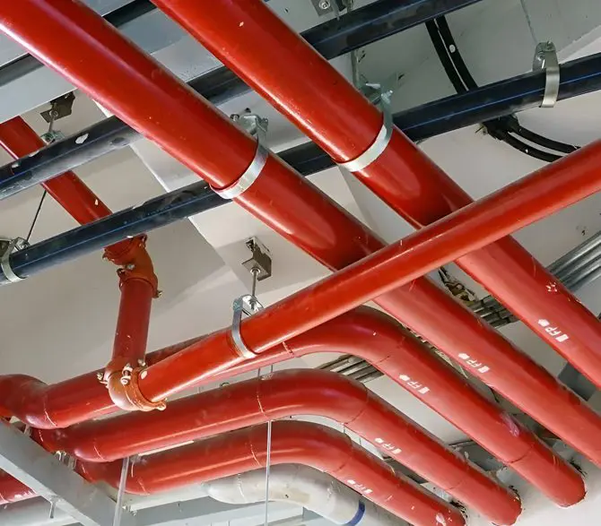 A red pipe system is connected to the ceiling.